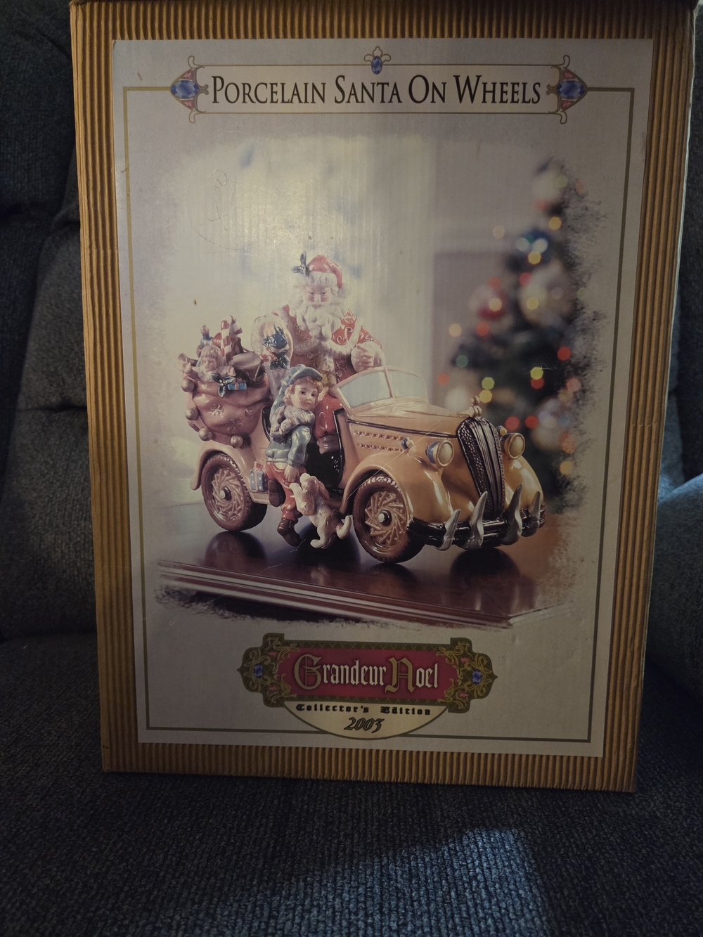 Grandeur Noel Porcelain Santa on Wheels - Gold Accent